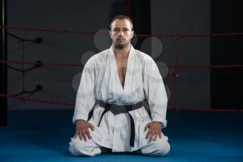 Young Man Practicing His Karate Moves - White Kimono - Black Belt