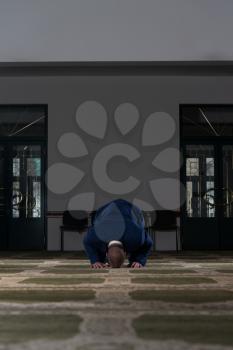 Businessman Muslim Making Traditional Prayer To God Allah In The Mosque