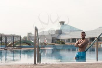 Fashion Portrait Of A Very Muscular Sexy Man In Underwear At Swimming Pool