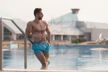 Fashion Portrait Of A Very Muscular Sexy Man In Underwear At Swimming Pool