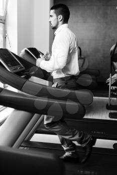 Businessman Running On Treadmill At A Health Club