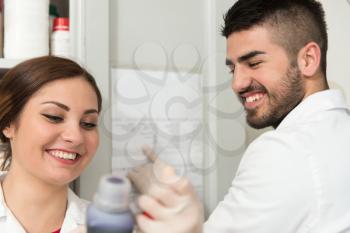 Group Of High School Students Working Together At Laboratory Class