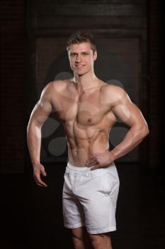 Portrait Of A Young Physically Fit Man Showing His Well Trained Body