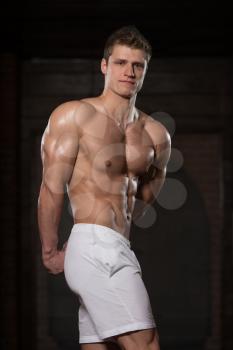 Portrait Of A Young Physically Fit Man Showing His Well Trained Body