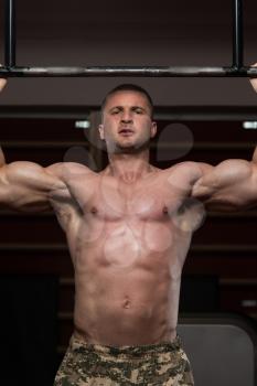 Adult Male Athlete Doing Pull Ups - Chin-Ups In The Gym - Best Exercise For Back