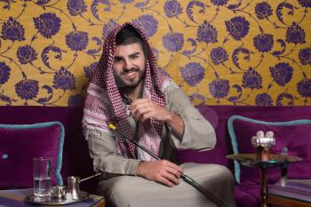 Muslim Man Smoking Shisha At Arabic Restaurant - Exhaling Smoke