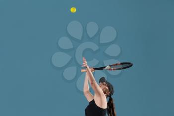 Portrait Of Female Tennis Player With Racket Ready To Serves Toss Ball