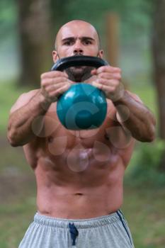 Young Fitness Male Exercise With Kettle Bell - Kettlebell Swing