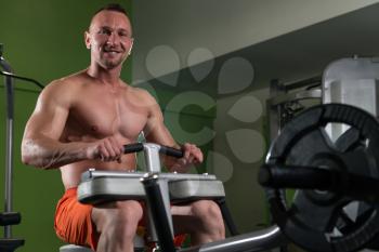 Bodybuilder Doing Heavy Weight Exercise For Legs Calves