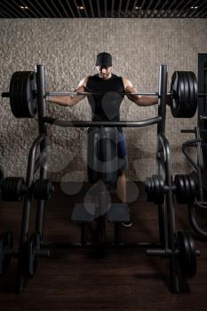 Healthy Young Man Resting In Healthy Club Gym After Exercising