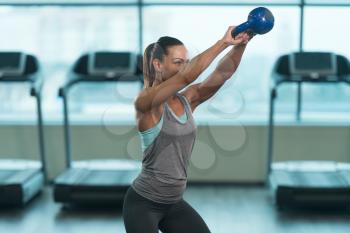 Young Woman Working With Kettle Bell In A Gym - Kettle-bell Exercise
