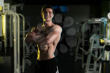 Bodybuilder Posing In Different Poses Demonstrating Their Muscles - Male Showing Muscles Straining - Beautiful Muscular Body Athlete