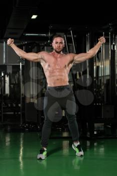 Portrait Of A Young Physically Fit Man Showing His Well Trained Body - Muscular Athletic Bodybuilder Fitness Model Posing After Exercises