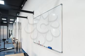 Whiteboard And Machines At The Modern Gym Room Fitness Center