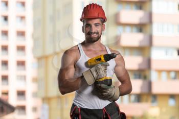 Successful Male Architect At A Building Site With Drill