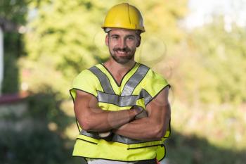 Successful Male Architect At A Building Site With Arms Crossed