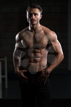 Portrait Of A Young Physically Fit Man Showing His Well Trained Body - Muscular Athletic Bodybuilder Fitness Model Posing After Exercises