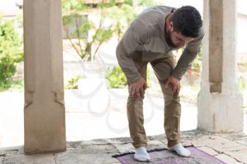 Muslim Man Is Praying In The Mosque Outdoors