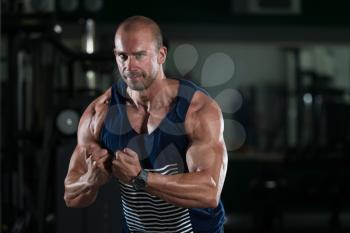 Portrait Of A Physically Fit Man Showing His Well Trained Body - Muscular Athletic Bodybuilder Fitness Model Posing After Exercises