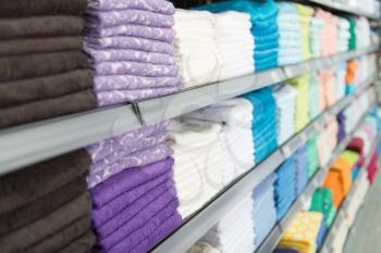 Big Shelf With a Colorful Stack Towels