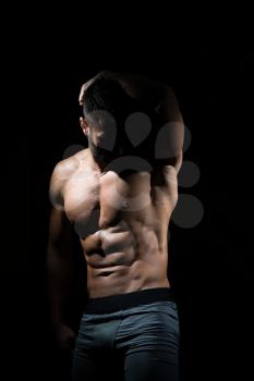 Portrait Of A Young Physically Fit Man Showing His Well Trained Body - Muscular Athletic Bodybuilder Fitness Model Posing After Exercises