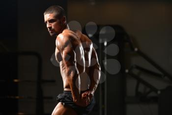 Portrait Of A Young Physically Fit Man Showing His Well Trained Body - Muscular Athletic Bodybuilder Fitness Model Posing After Exercises