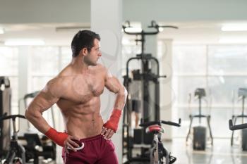 Handsome Man In Red Boxing Gloves - Boxing In Gym - The Concept Of A Healthy Lifestyle - The Idea For The Film About Boxing