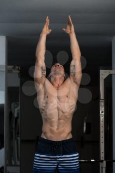 Portrait Of A Young Physically Fit Man Showing His Well Trained Body - Muscular Athletic Bodybuilder Fitness Model Posing After Exercises