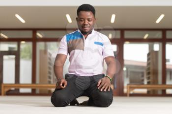 Black African Muslim Man Is Praying In The Mosque