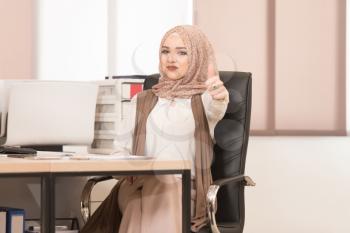 Happy Smiling Cheerful Muslim Business Woman With Thumbs Up Gesture