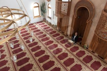 Businessman Muslim Is Reading The Koran Making Traditional Prayer to God Allah in the Mosque