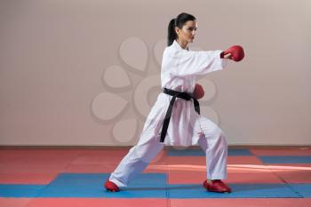 Young Woman Dressed In Traditional Kimono Practicing Her Karate Moves - Black Belt