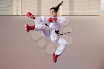 Young Woman Dressed In Traditional Kimono Practicing Her Karate Moves - Black Belt