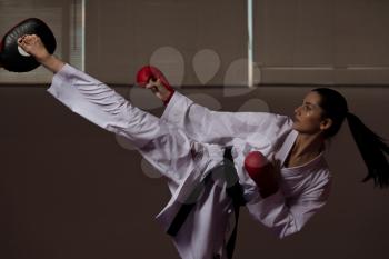 Young Woman Dressed In Traditional Kimono Practicing Her Karate Moves - Black Belt