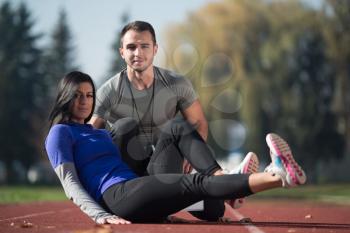 Attractive Couple Exercising in City Park Area - Training and Exercising for Endurance - Fitness Healthy Lifestyle Concept Outdoor