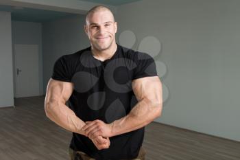 Healthy Man Standing Strong In Army Pants And Flexing Muscles - Muscular Athletic Bodybuilder Fitness Model Posing After Exercises