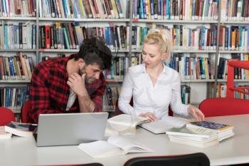 Students Preparing Exam and Learning Lessons in School Library Making Research on Laptop and Browse Internet in the Library