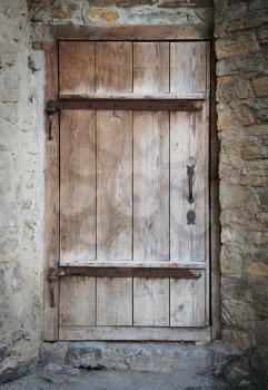 old wooden door in a stone wall