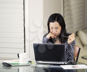 Mature women analyzing data from home office
