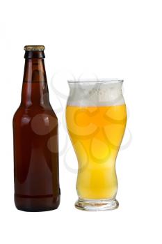 Vertical photo of a fresh beer in a tall curved shaped glass along with an unopened beer in bottle isolated on white background