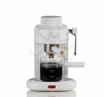 Cappuccino espresso machine with fresh coffee in glass pot on white with reflection