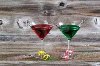 Horizontal image of colorful cocktail drinks on rustic wood with ribbons 