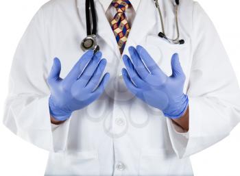 Close up front view of doctor with blue latex gloves on hands 