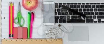Back to School evolution with traditional supply items merging into modern technology 