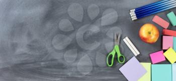 Back to School traditional items on chalkboard in flat layout view