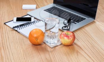 Healthy food and water with clean working wooden desktop 