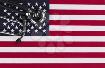 Medical stethoscope with United State flag as background with copy space  