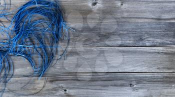 Blue confetti on weathered wooden planks for Happy Fathers Day concept