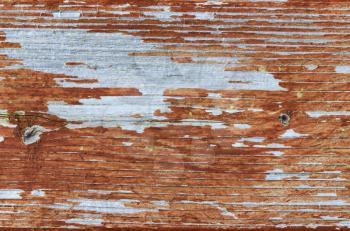 Close up of outdoor cedar wood with faded stain plus mildew in full frame format 