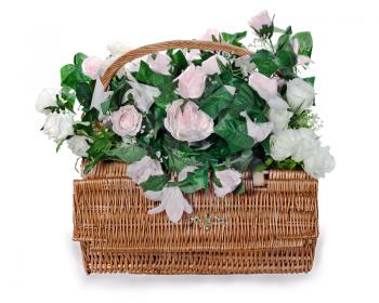 colorful flower bouquet arrangement from white and pink roses centerpiece in a wicker gift basket isolated on white background.